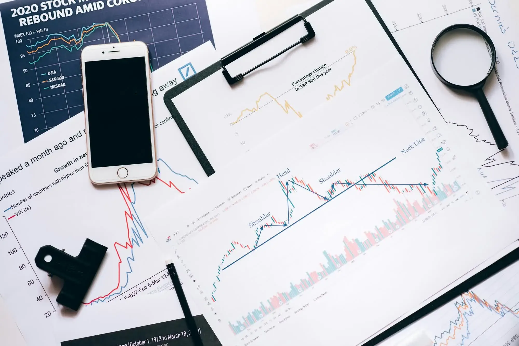desk filled with sheets of data